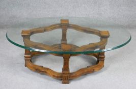 A Continental style walnut coffee table with plate glass top. H.43 W.130 D.80