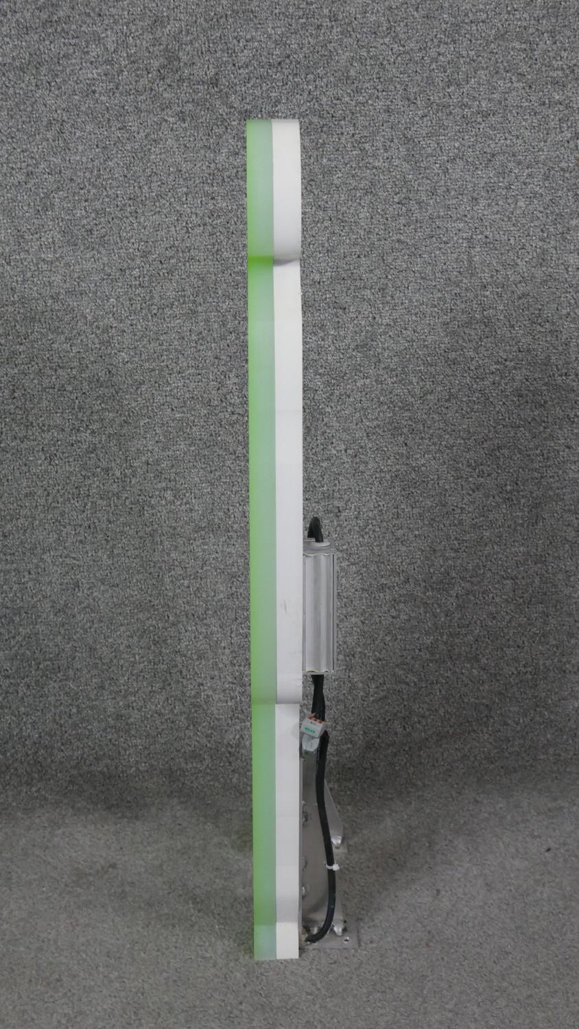 A neon green and white acrylic light in the form of a figure. H.73 W.22 D.4cm - Image 2 of 5