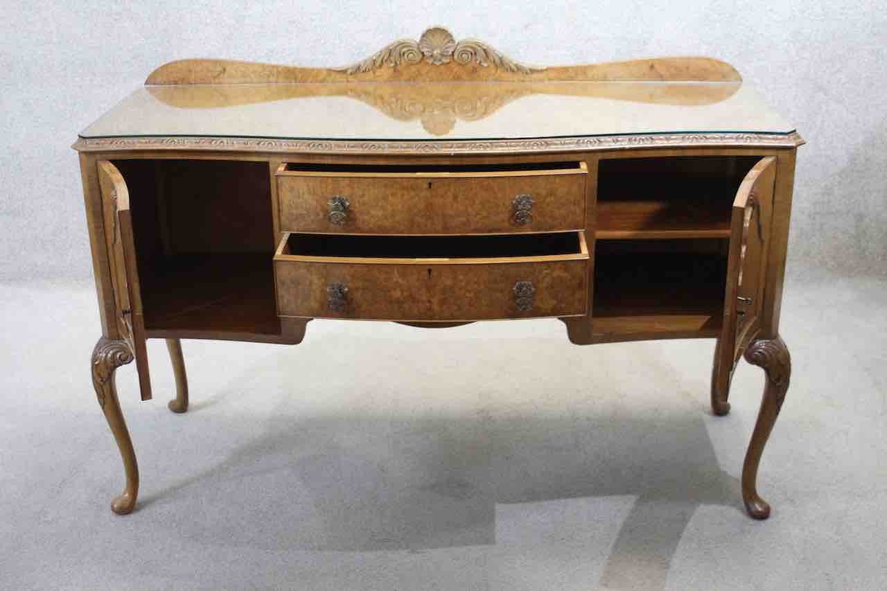 A mid century burr walnut Epstein sideboard with central drawers flanked by cupboards on carved - Image 3 of 7