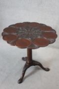 A Georgian mahogany oyster dish carved tilt top occasional table with birdcage action on fluted