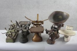 A collection of five sets of vintage painted cast iron shop scales. H.29 W.55 D.27cm.