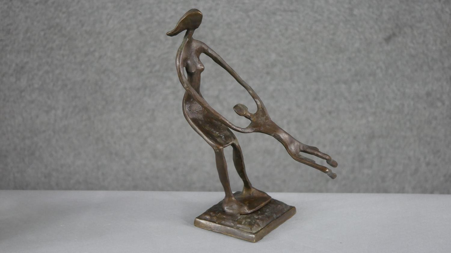 An Art Deco ceramic minstrel vase, a bronze effect moulded figure of a mother swinging her child and - Image 3 of 4