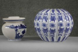 Two Chinese porcelain blue and white pieces. One gourd shaped foliate design vase along with a
