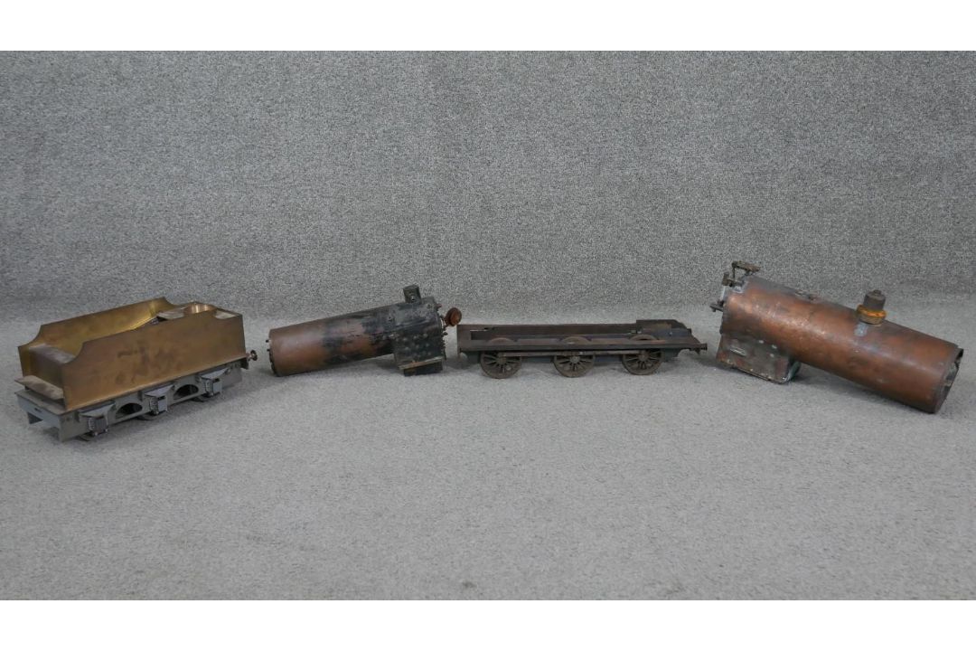Four handmade copper and iron model steam locomotive parts. Including two boilers, a wagon and - Image 1 of 8