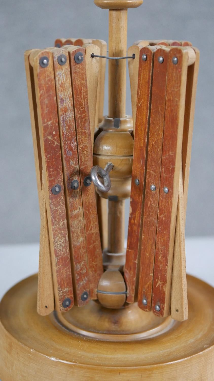 A 19th century treen wool spinner with four extending arms and a turned circular base. H.23 W. - Image 3 of 5