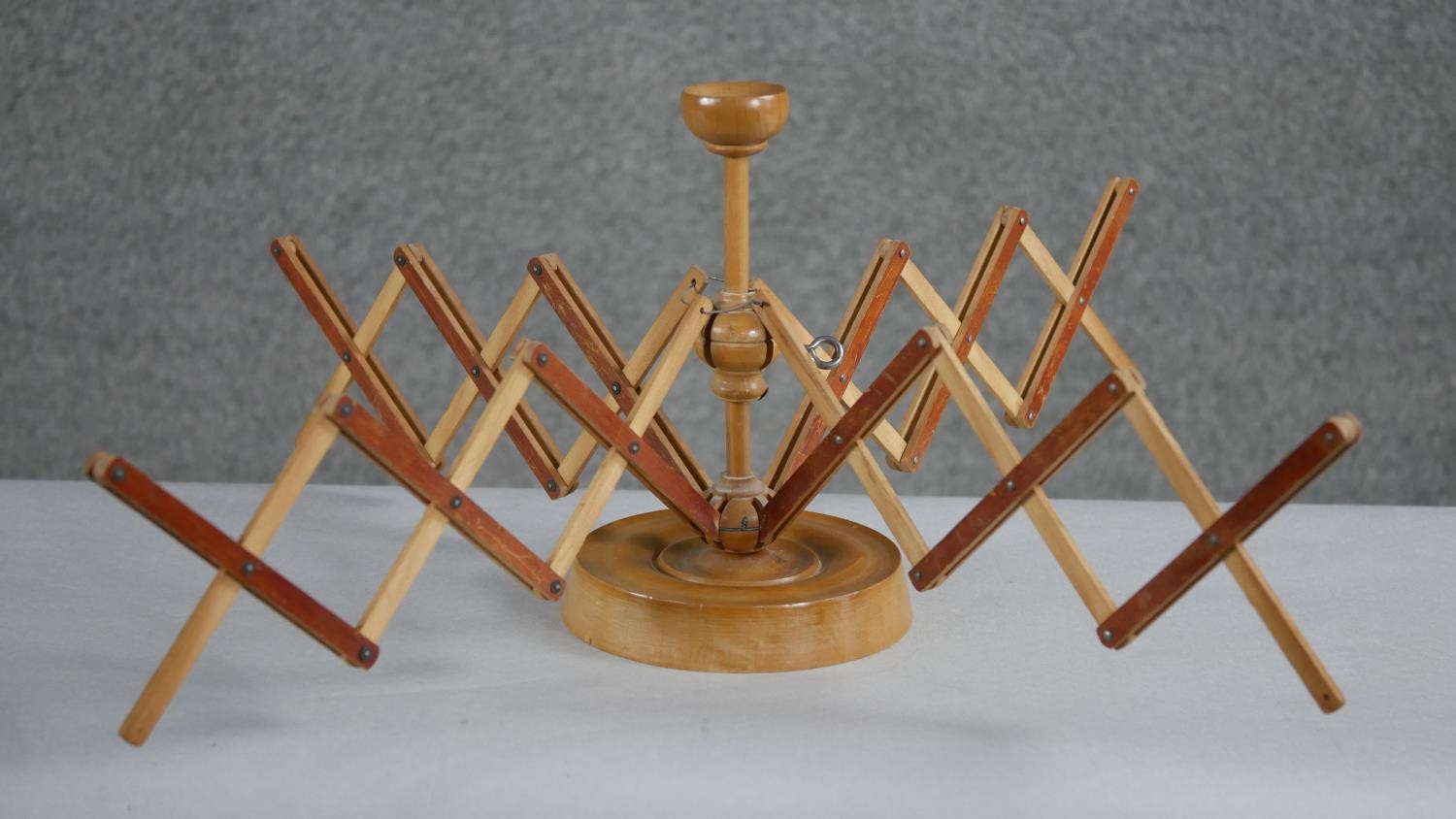 A 19th century treen wool spinner with four extending arms and a turned circular base. H.23 W. - Image 2 of 5