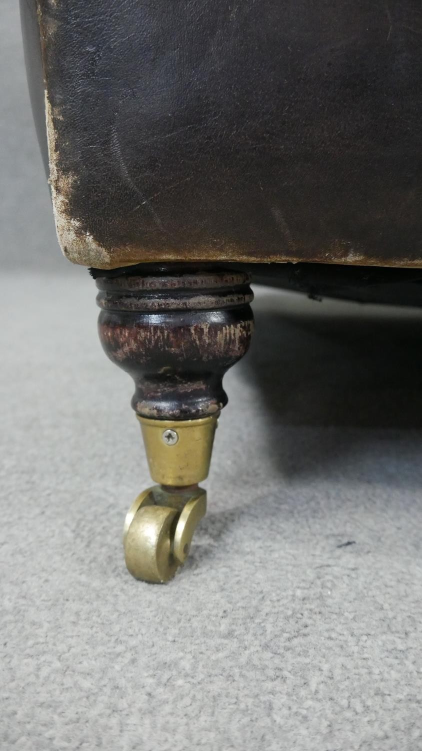 A Howard style two seater sofa in leather upholstery on turned supports terminating in brass - Image 5 of 7