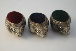 Three novelty Danish silver hedgehog pin cushions. With green, maroon and navy blue cushions.