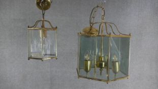 Two Victorian style brass and glass hexagonal lanterns with etched star motifs. One with four