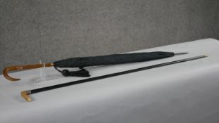 An early 20th century horn handled black silk parasol with 9 carat gold collars, hallmarked:James