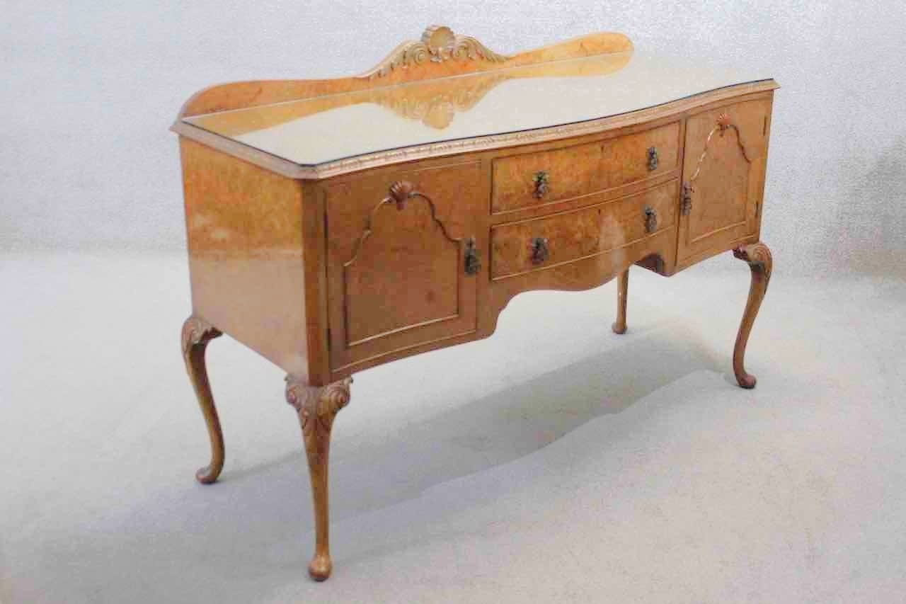 A mid century burr walnut Epstein sideboard with central drawers flanked by cupboards on carved - Image 7 of 7