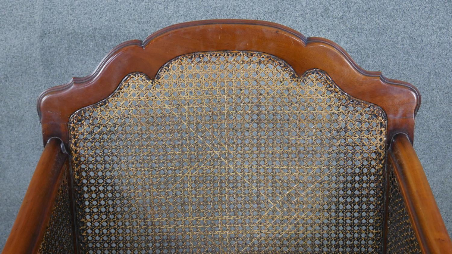 A pair of mid century carved walnut bergere armchairs with double caned sides in cut floral - Image 8 of 9