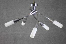 A contemporary chrome and frosted glass twist design five branch ceiling chandelier. The lamp shades