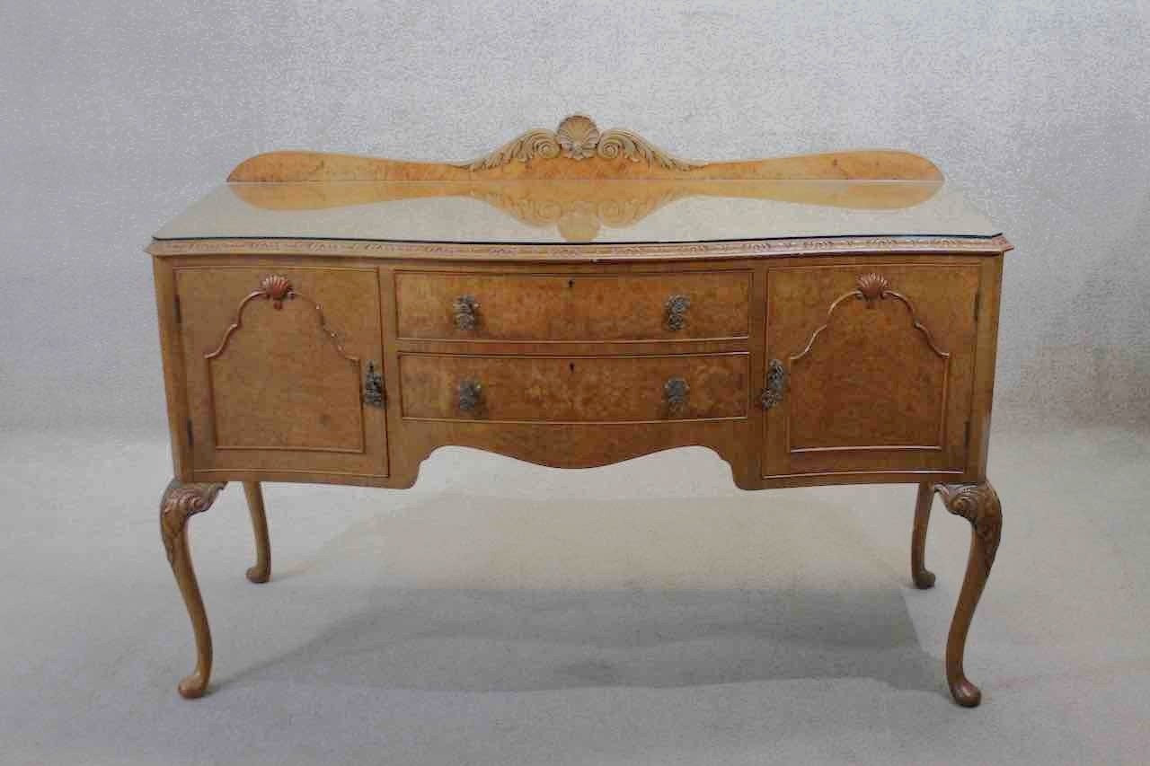 A mid century burr walnut Epstein sideboard with central drawers flanked by cupboards on carved - Image 2 of 7