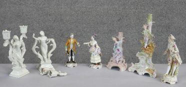 A collection of hand painted porcelain figures. Including two Capodimonte figurines, one of a male