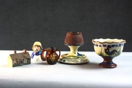 A collection of ceramics. Including two piece of Torquay ware, a Royal Doulton Kingsware Dickens