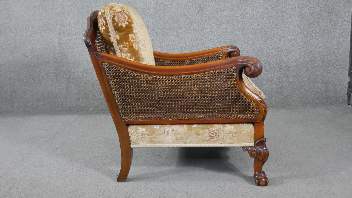 A pair of mid century carved walnut bergere armchairs with double caned sides in cut floral - Image 4 of 9