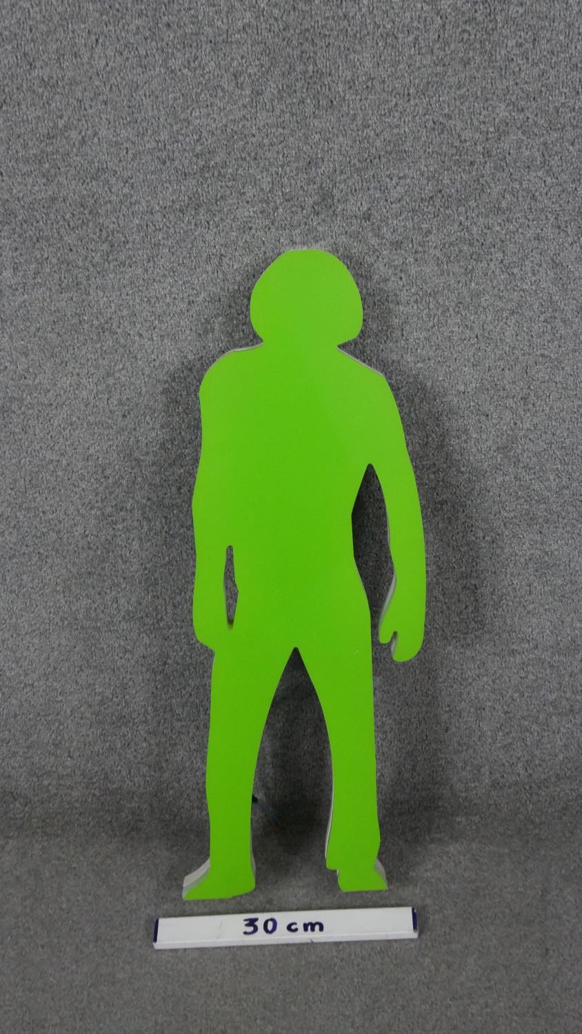 A neon green and white acrylic light in the form of a figure. H.73 W.22 D.4cm - Image 5 of 5