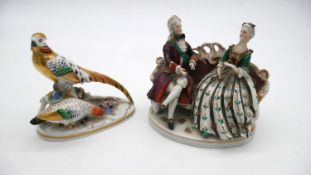 A Crown Staffordshire model of a pheasant, desgned by J. T. Jones along with a Potschapel figure