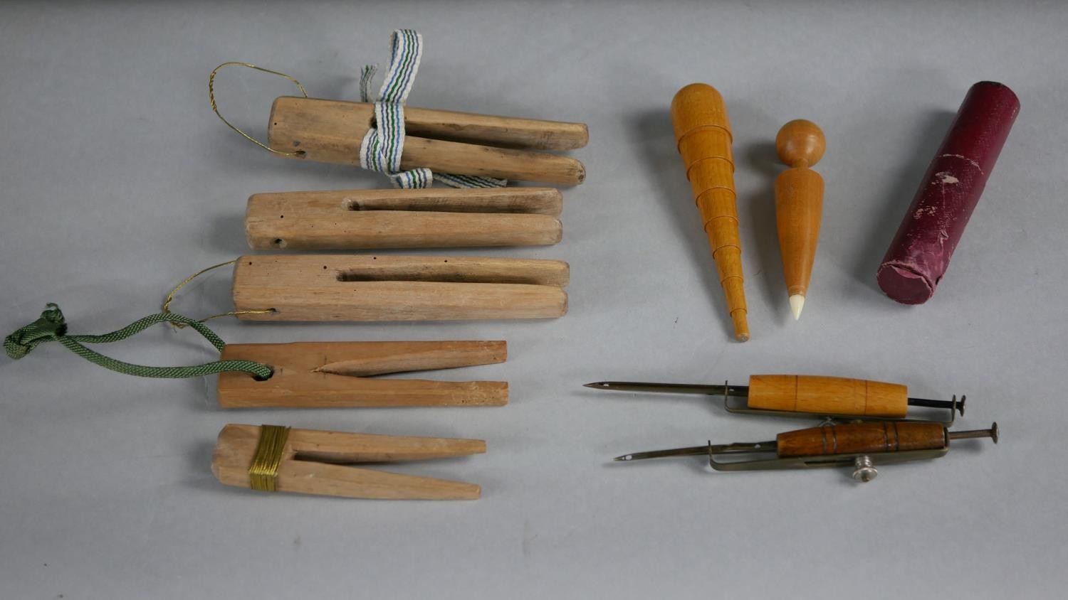 A collection of 19th century sewing items. Including wooden wool pegs, a fabric marker and other - Image 2 of 6