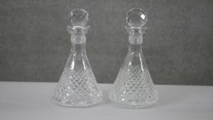 A pair of Tyrone cut crystal conical design decanters with ball stoppers. Stamped to the base. H.