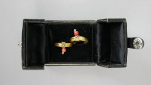 A pair of antique yellow metal (tests higher than 18 carat) and coral bead crescent moon hoop