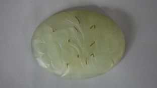 A 20th century Chinese carved celadon jade bowl and stand along with a carved jade plaque with