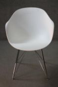 A contemporary Eames style tub chair.