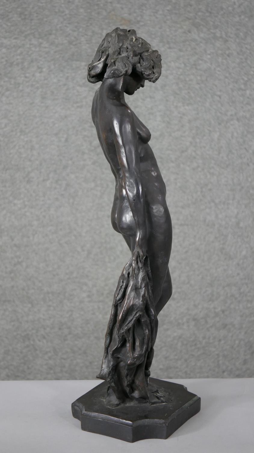 Ron Moll- A contemporary bronzed cold cast resin figure of a nude woman holding a cloth. Signed R. - Image 4 of 6