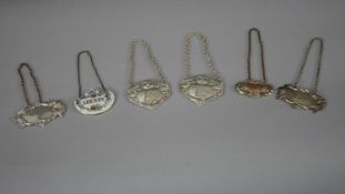 A collection of drinks labels. Including two figural design silver drinks labels (Sherry and