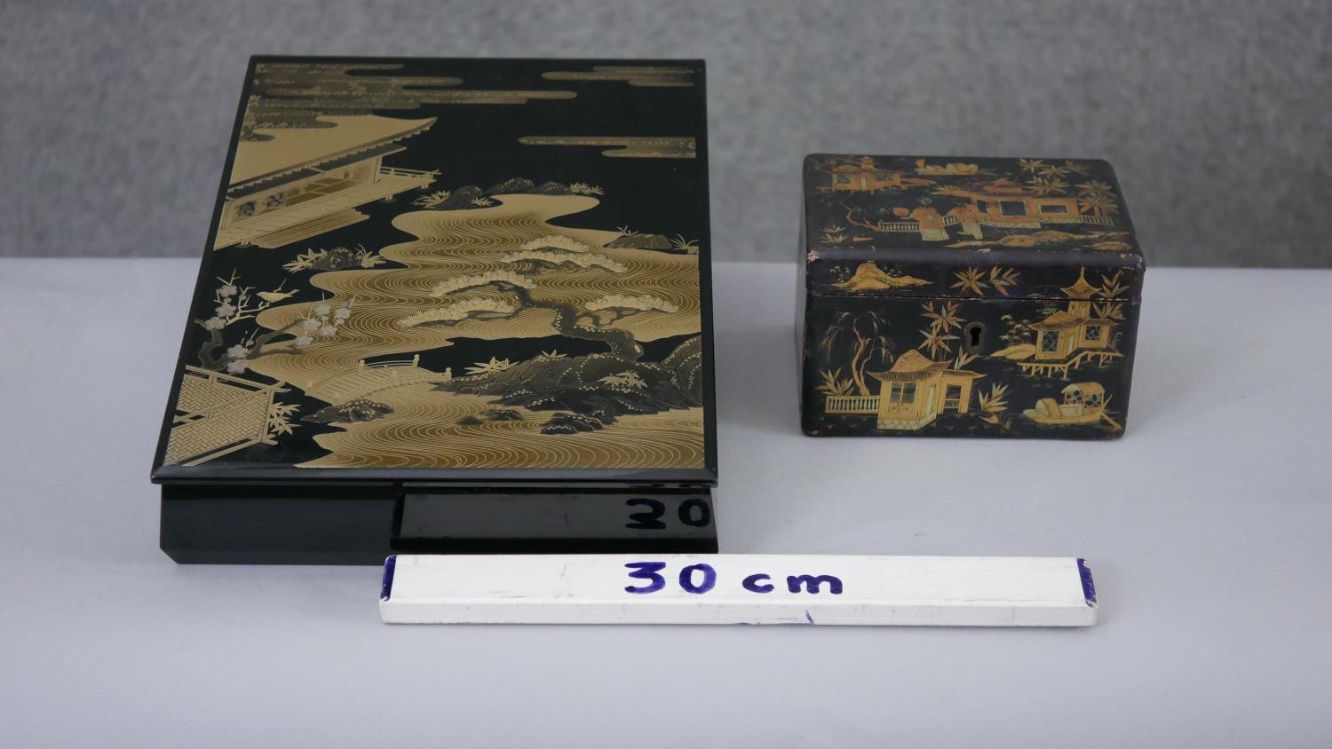 Two Japanese gilded lacquered boxes. One a tea caddy with partitions decorated with a village - Image 2 of 8