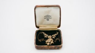 A Victorian 15 carat yellow gold and seed pearl articulated floral design necklace/brooch with chain