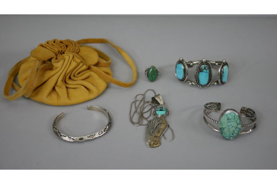 A collection of Native American turquoise jewellery with a yellow suede pouch. Including two - Image 1 of 8