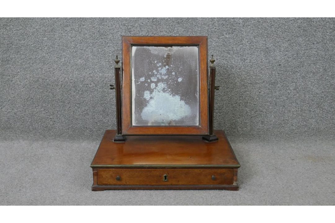 A 19th century mahogany toilet mirror with adjustable swing mirror on platform base fitted with - Image 1 of 5