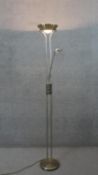A brushed chrome dimming uplighter with adjustable reading light arm. H.179 W.75cm