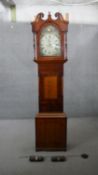 A Georgian figured mahogany longcase clock signed W. Raw Whitby with swan neck pediment, painted
