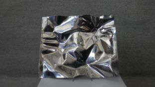 After Verner Panton- A Georg Jensen mirror polished stainless steel folded design platter. Signed to