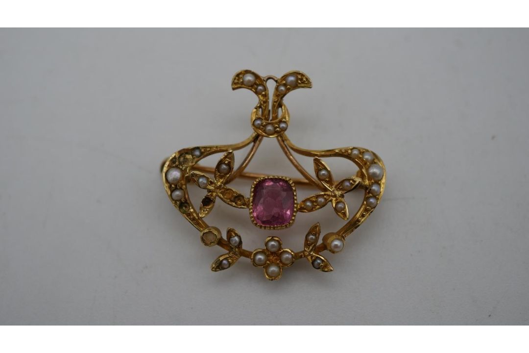 A Victorian yellow metal (tested 15 carat) seed pearl and pink stone brooch/pendant. Set with thirty - Image 1 of 7