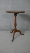A mid century Georgian style figured walnut occasional table with piecrust edge on tripod cabriole
