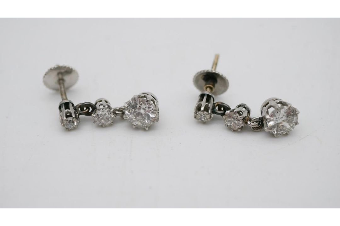 A pair of antique white metal (tested platinum) old cut diamond articulated drop earrings. Each - Image 1 of 5