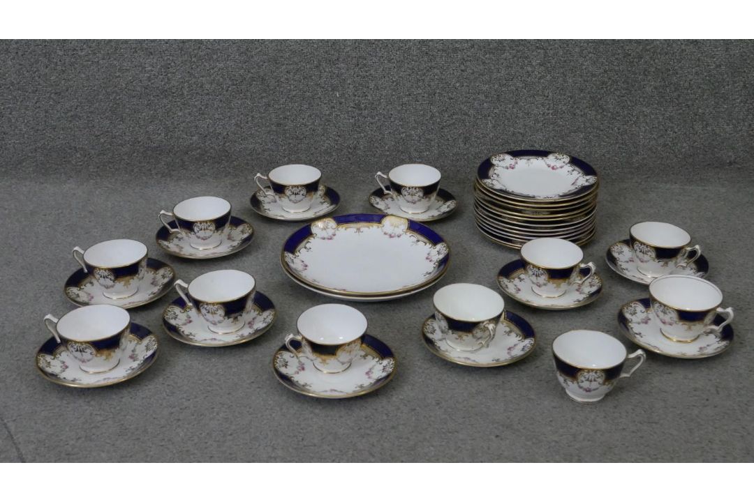 A Crown Staffordshire fine china royal blue and gold twelve person hand painted part tea set. - Image 1 of 6