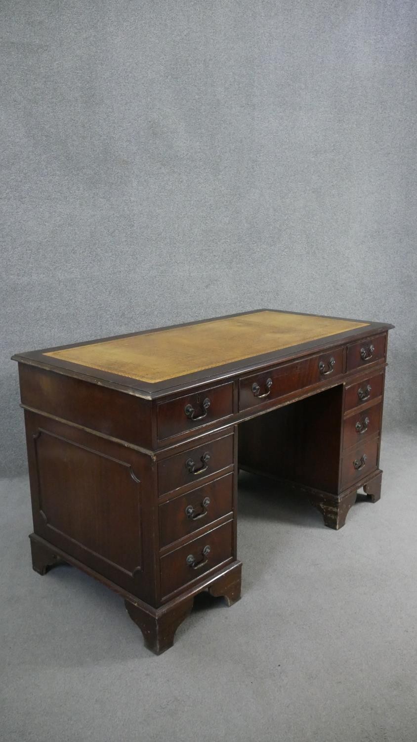 A Georgian style mahogany pedestal desk with inset tooled leather top on bracket feet. H.75 W.136 - Image 3 of 6