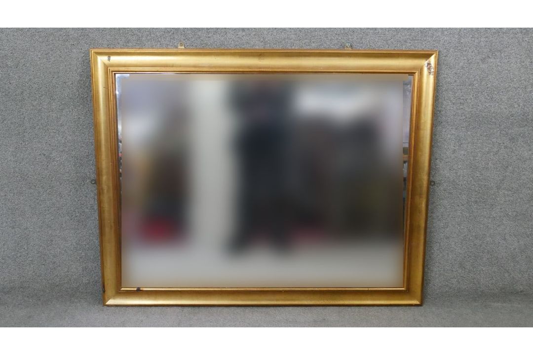 A wall mirror in moulded gilt frame. H.93 W.118 cm - Image 1 of 4