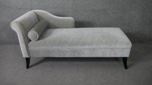 A 19th century style chaise in velour upholstery on ebonised swept supports. H.80 W.155 D.70 cm