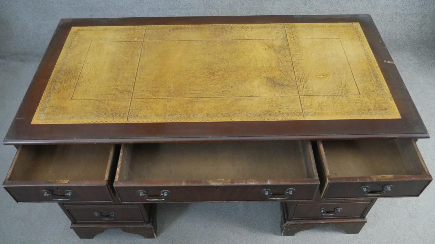 A Georgian style mahogany pedestal desk with inset tooled leather top on bracket feet. H.75 W.136 - Image 4 of 6