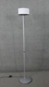 A contemporary standard lamp style reading light with adjustable directional bulb. H.177 Diam.30 cm