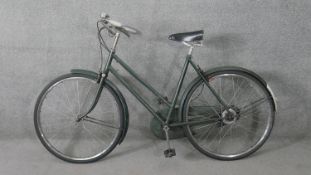 A vintage ladies Raleigh town bike.