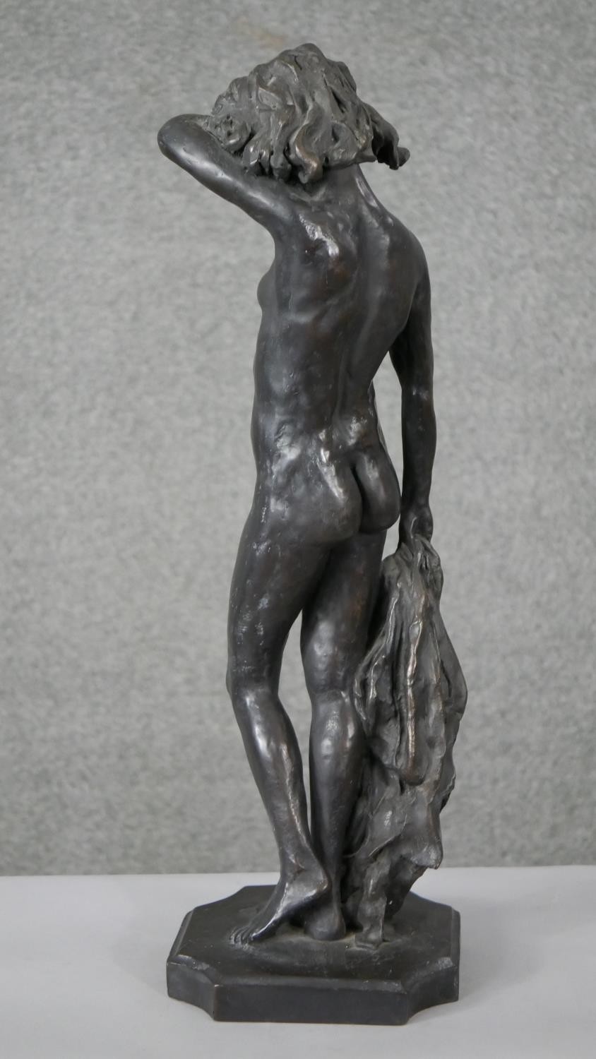Ron Moll- A contemporary bronzed cold cast resin figure of a nude woman holding a cloth. Signed R. - Image 5 of 6