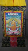 An early 20th century Tibetan Thanka of Buddha. Full silk brocade surround and hanging pole. H.135
