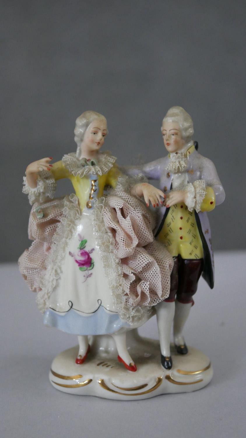 A pair of black and white Staffordshire pottery spaniels along with a hand painted Dresden porcelain - Image 5 of 7